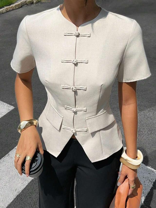 faux linen round neck peplum top with frog closures