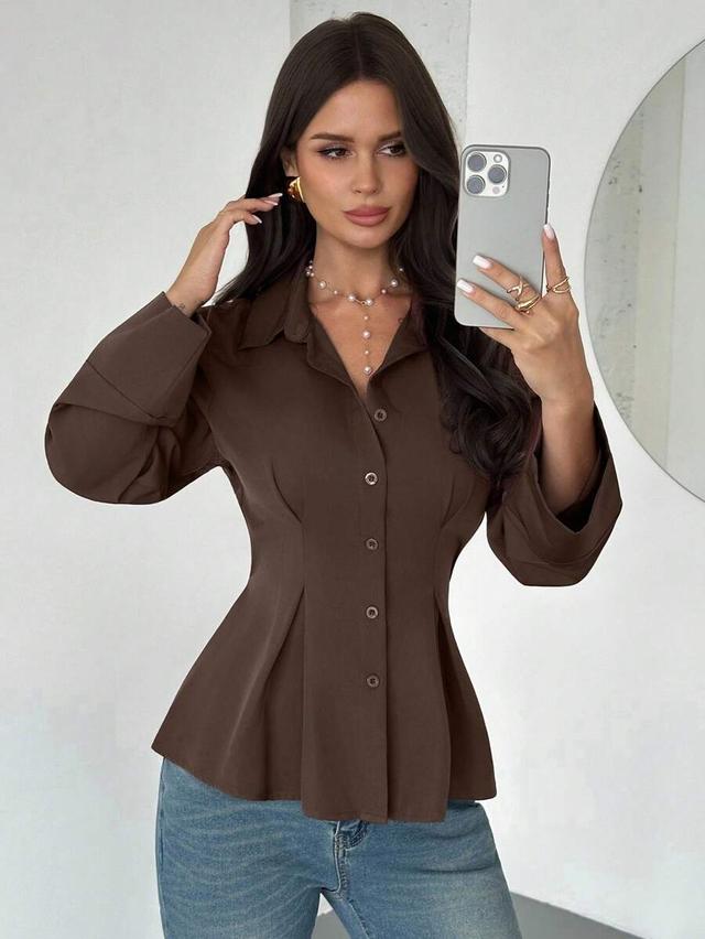 dark brown long-sleeved waist-cinched button-up shirt