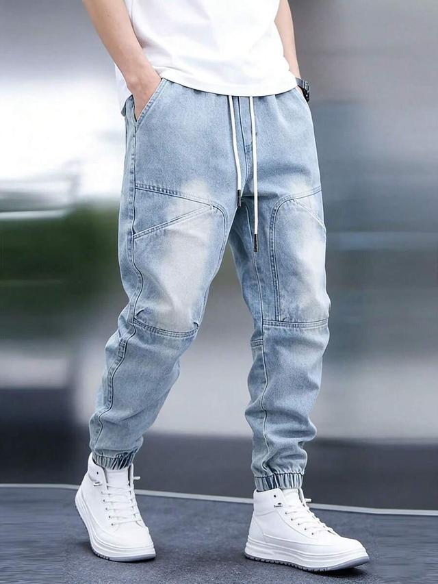 light wash denim joggers with tapered leg design