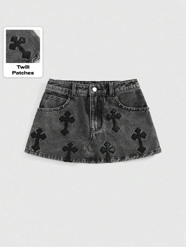 acid wash denim mini skirt with cross appliqués