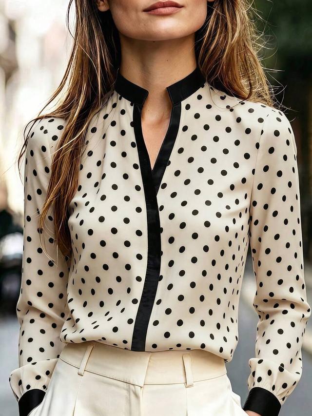elegant white polka dot blouse with contrast black collar