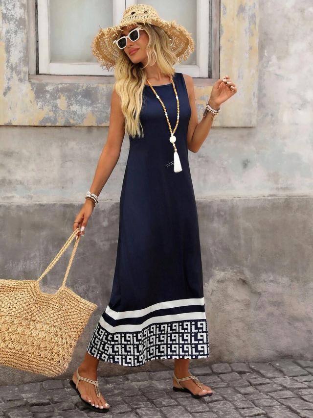 navy blue sleeveless maxi dress with geometric hem
