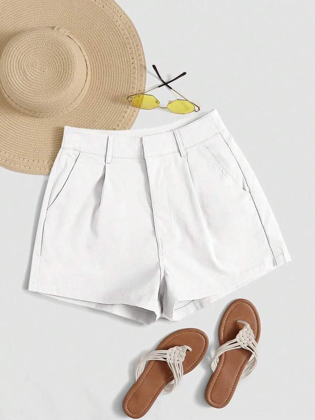 white high-waisted tailored pleated shorts