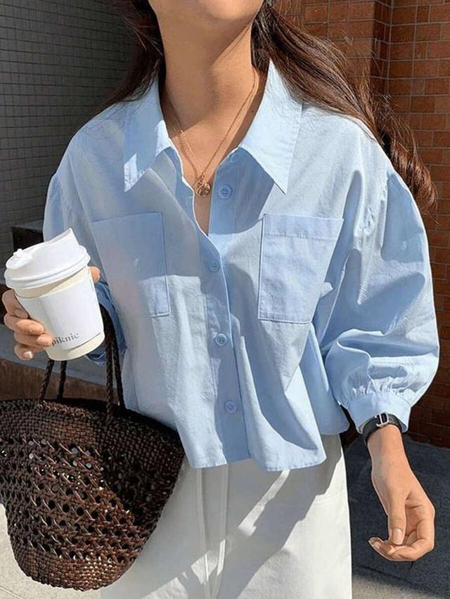 light blue cotton button-down shirt with patch pockets