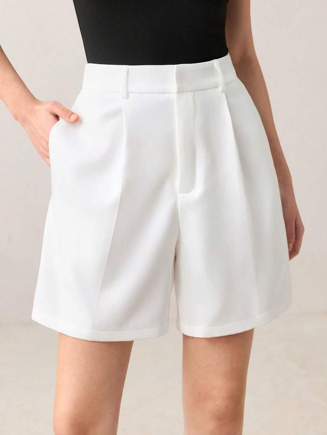 white pleated high-waisted tailored shorts