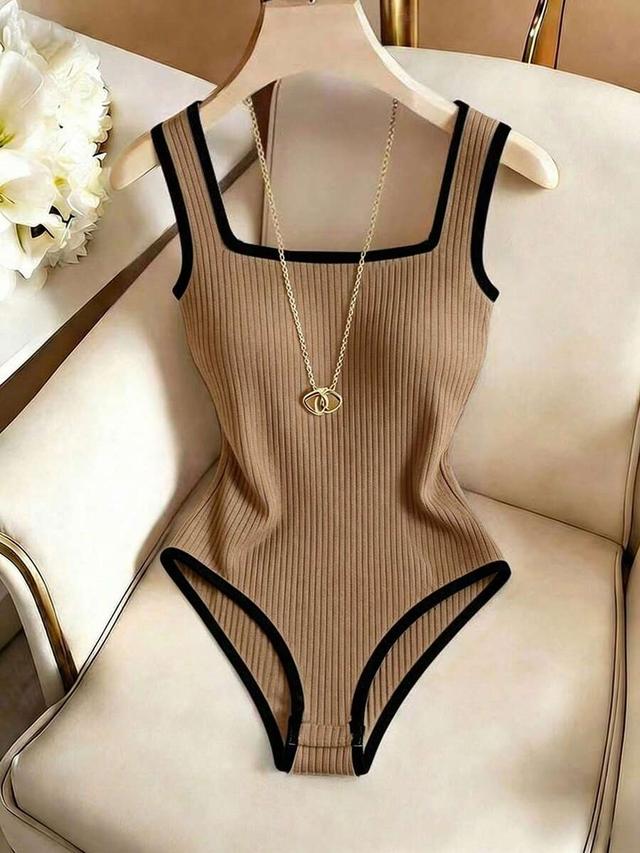 apricot ribbed bodysuit with black contrast trim