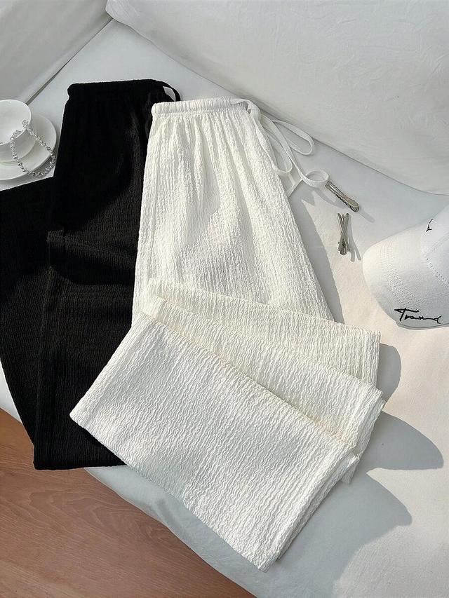 white and white minimalist relaxed fit straight leg trousers
