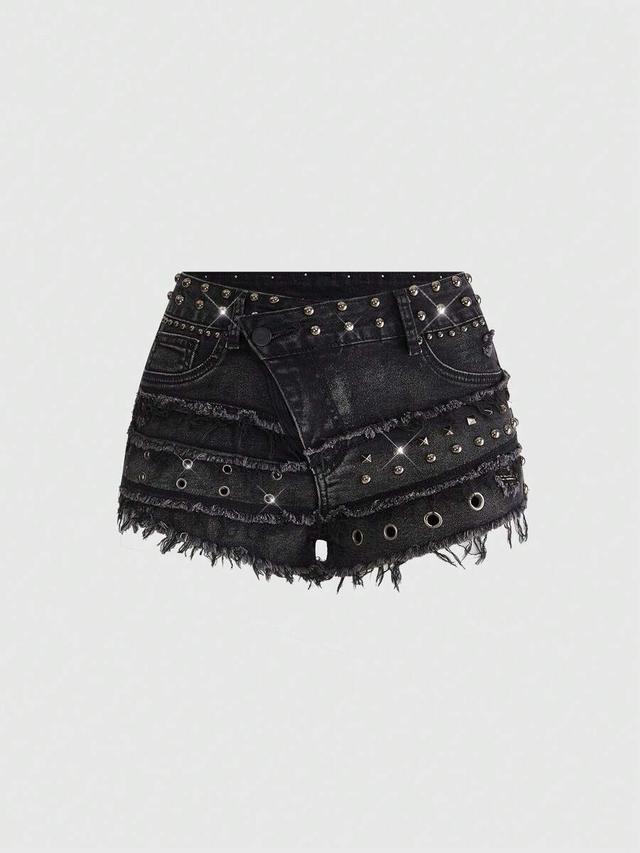 distressed black denim shorts with metal studs and grommets