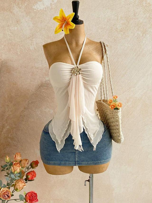 asymmetrical halter top with decorative floral brooch