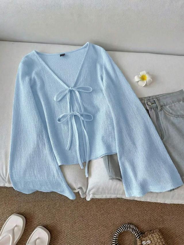 baby blue textured tie front flare sleeve top