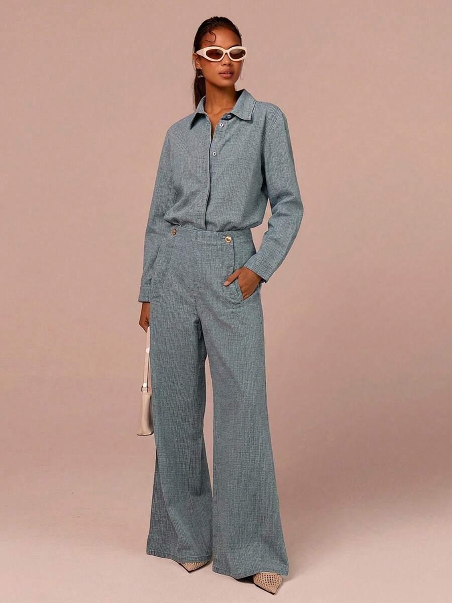 blue textured button-up shirt and matching wide-leg trousers