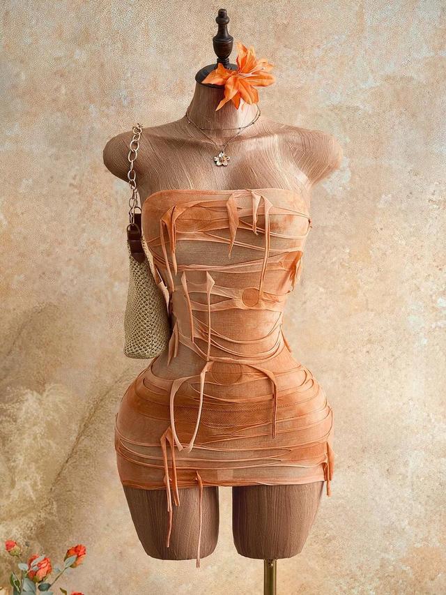 distressed orange strapless mini dress with raw edge strips