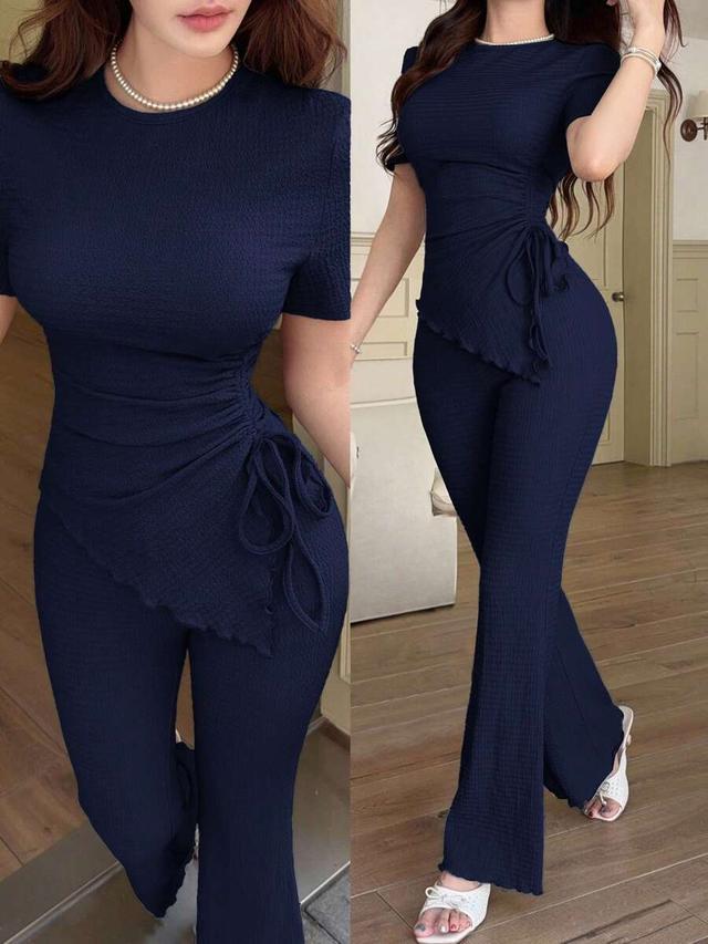 navy blue pleated short sleeve top and flare pants set