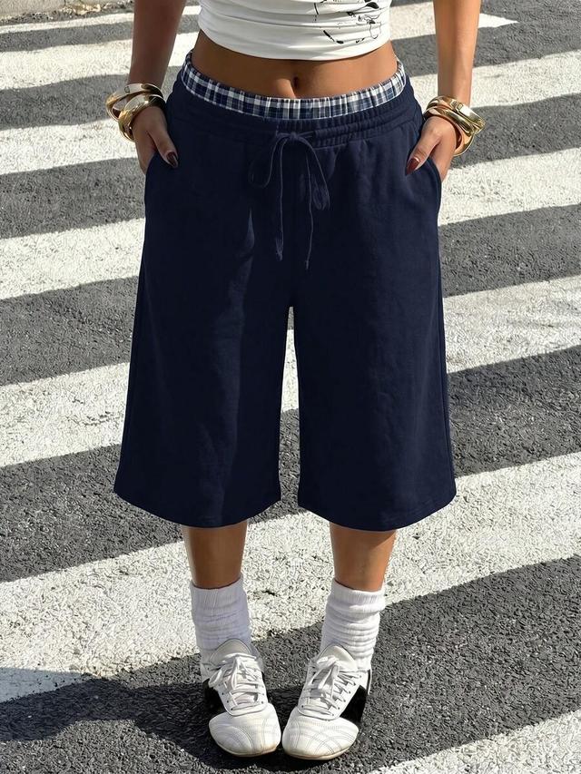 navy blue knit casual athleisure bermuda shorts
