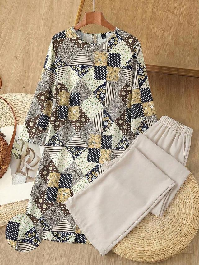 geometric patchwork print tunic dress with beige wide-leg trousers