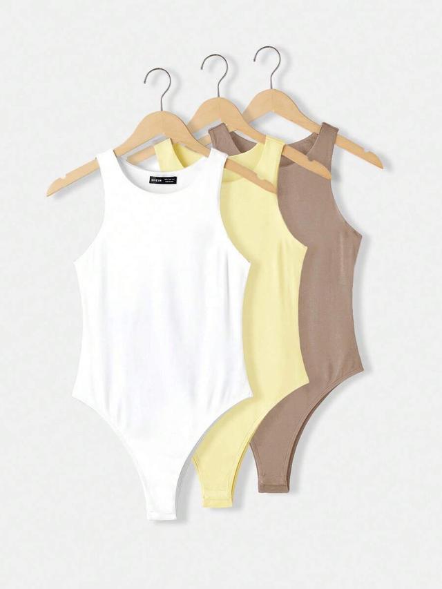 white fitted sleeveless crew neck knit bodysuit set