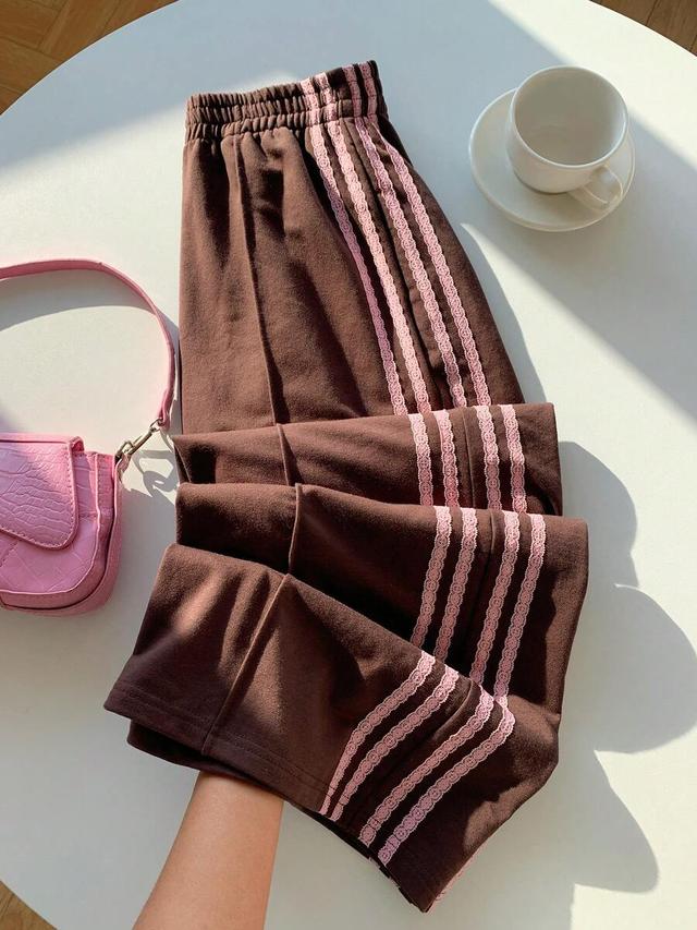 brown wide leg sweatpants with pink lace side stripes