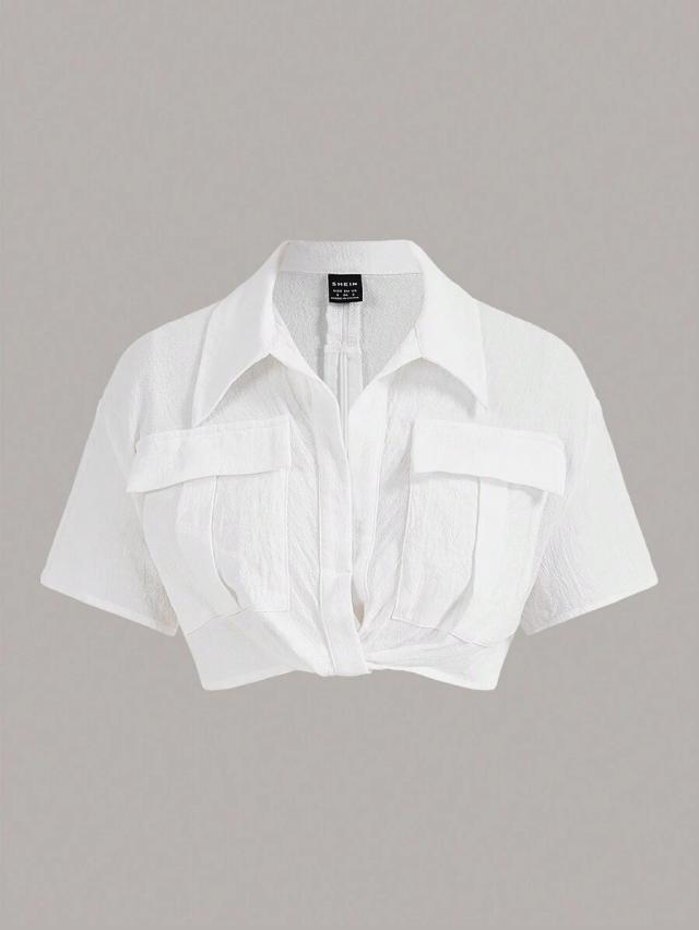 white textured short sleeve crop shirt with flap pockets