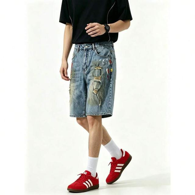men's denim shorts with paint splatter and distressing