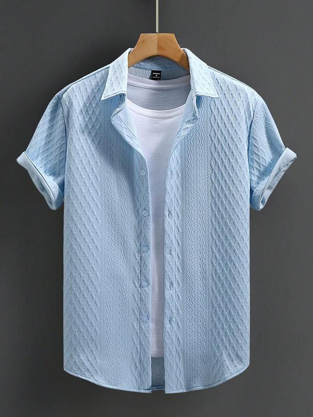 light blue textured short sleeve button-up shirt