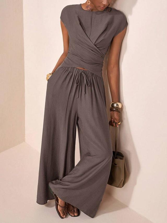 grey round neck overlapping hem linen blend top