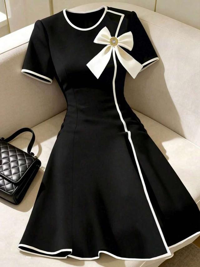 franclia black short sleeve dress with white piping and bow