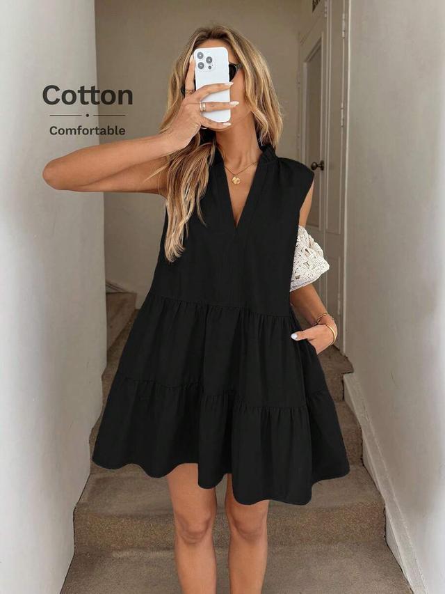 sleeveless black stand collar tiered mini dress