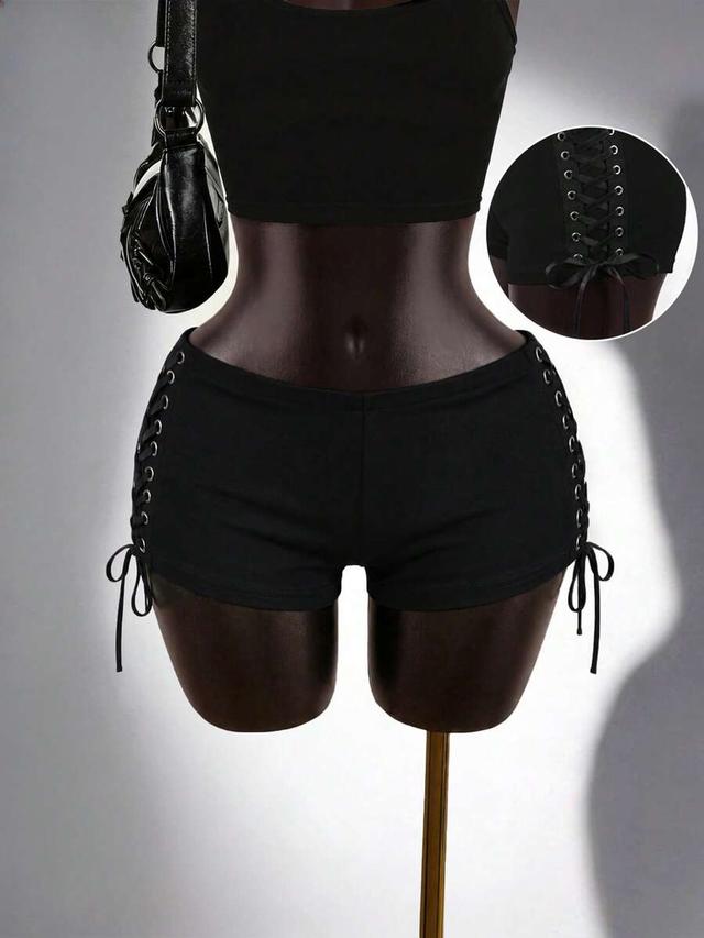 black super short shorts with side metal eyelet ties