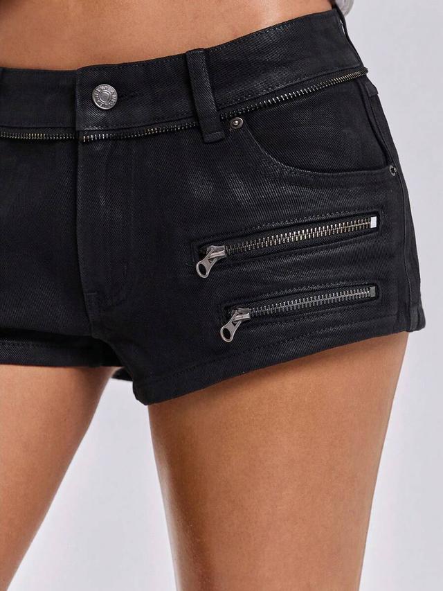 black low-rise denim shorts with multiple zipper details