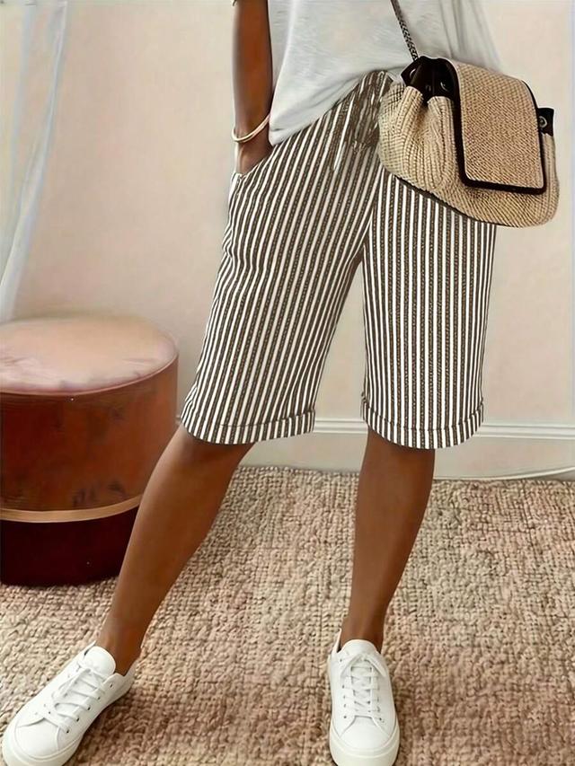 black and white vertical striped drawstring knee length shorts
