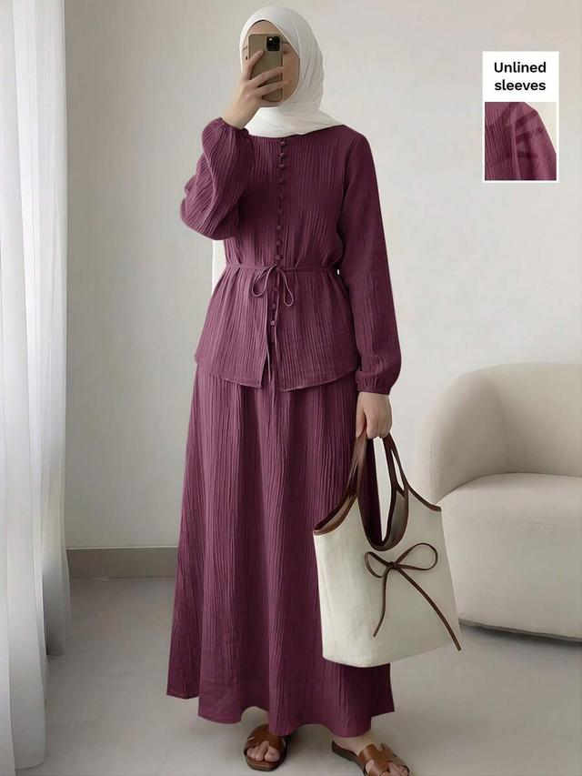 dark purple textured long sleeve top and skirt set