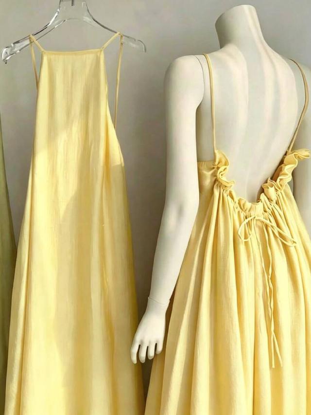 pale yellow open back midi dress