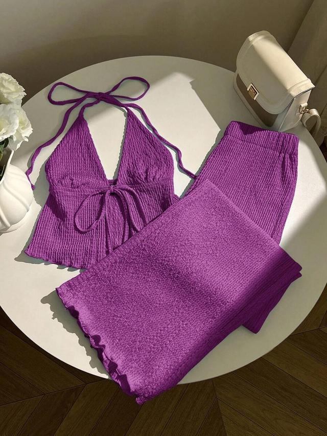 purple textured halter top with pleated hem