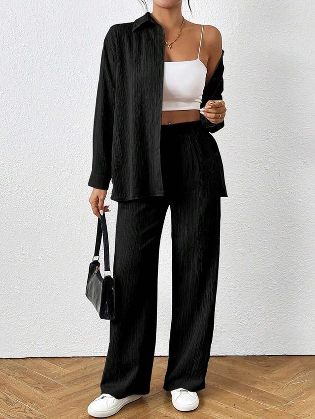 black textured long sleeve shirt and trousers set