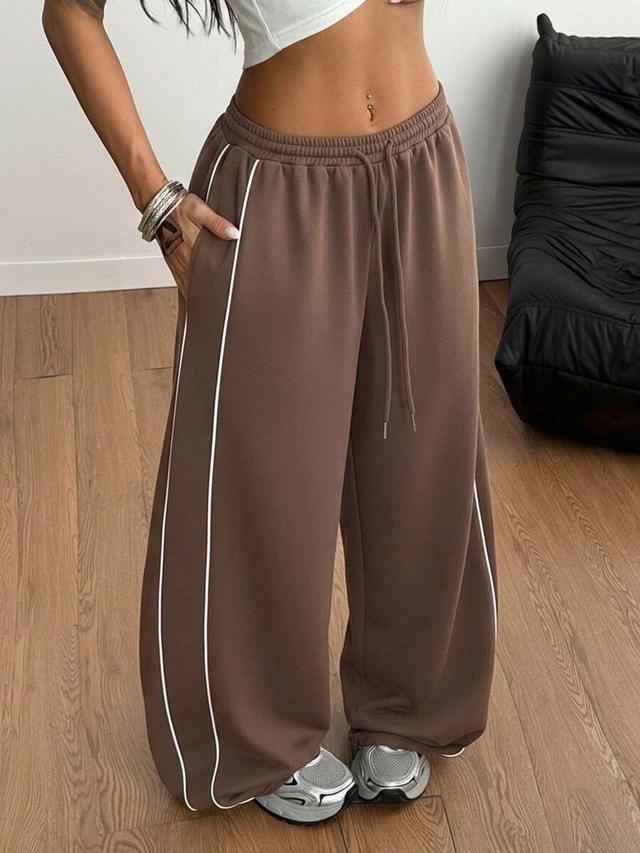 brown baggy logo pattern low rise sweatpants
