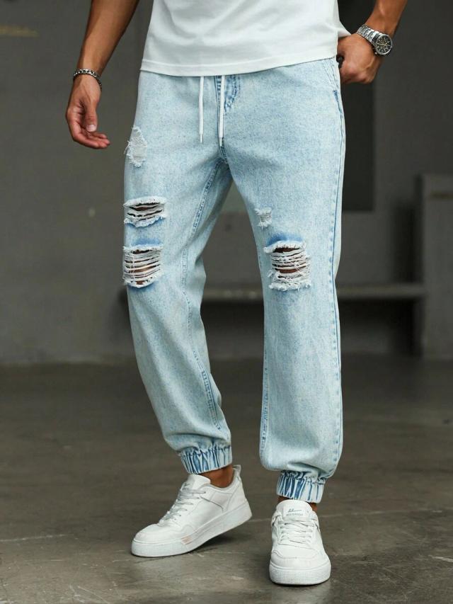 light wash distressed denim drawstring tapered jeans
