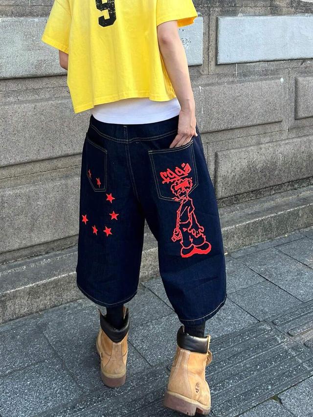 loose fit dark denim shorts with red cartoon print