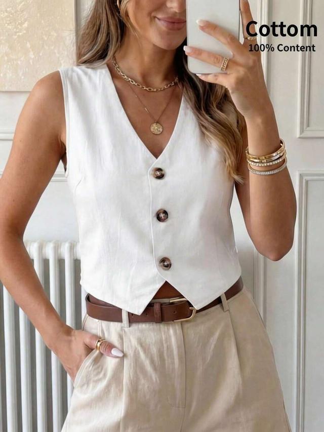 white sleeveless tailored button-up vest blouse