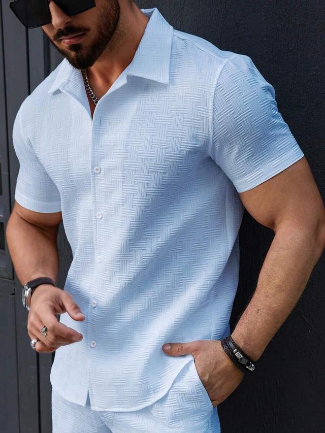 light blue textured short sleeve button-up shirt