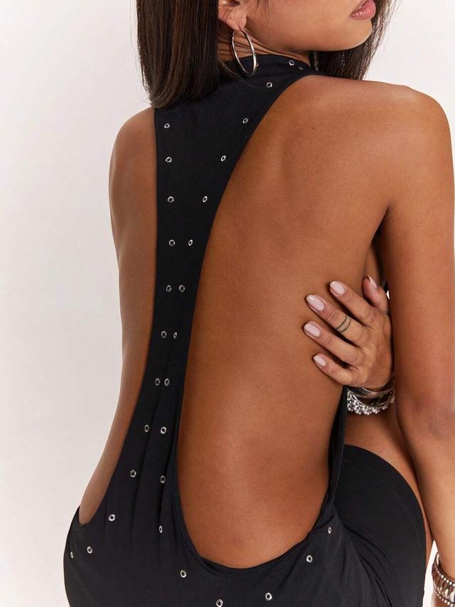 black racerback dress with silver grommet detailing