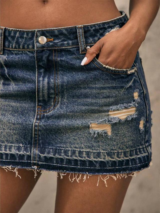 distressed blue denim mini skirt with raw hem