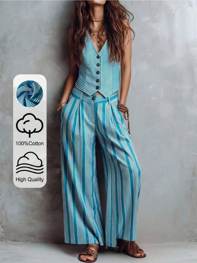 teal blue striped v-neck vest and pleated wide-leg trousers