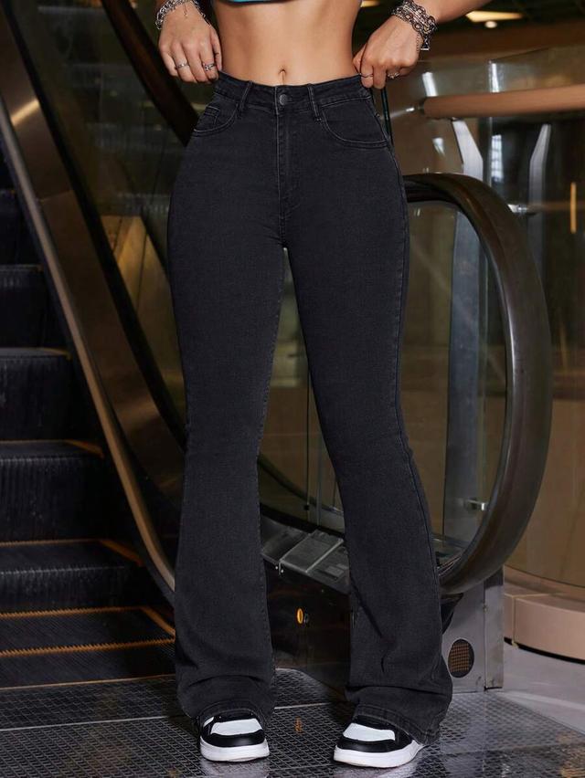 solid black flared denim jeans with slanted pockets