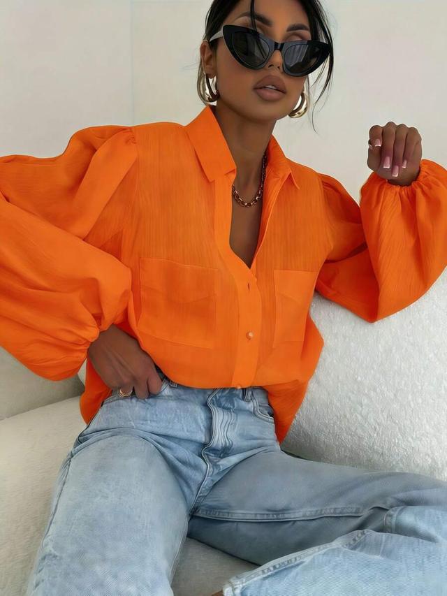 bright orange textured puff sleeve button down blouse