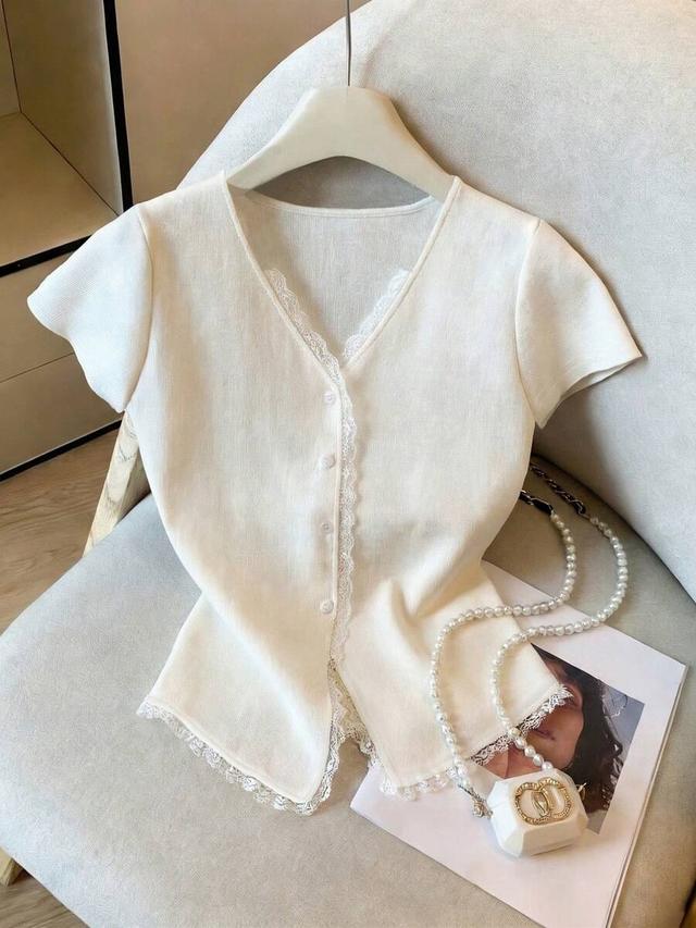 white knit v-neck blouse with contrast lace trim
