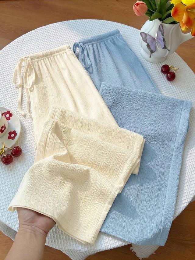 light blue textured wide leg pants in cream and light blue