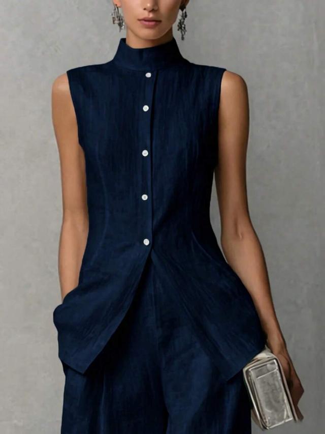 navy blue sleeveless button-down top and wide leg pants