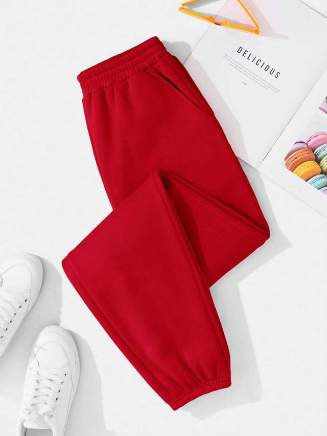 solid red elastic waist slant pocket sweatpants