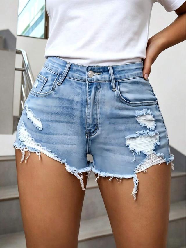 distressed light wash denim shorts with raw hem