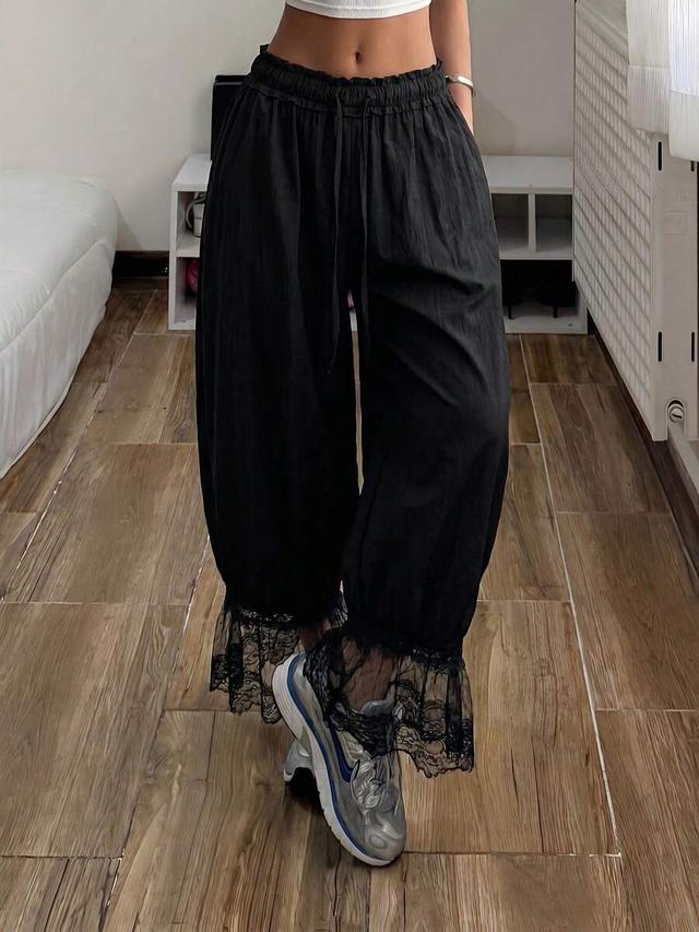black drawstring waist wide leg pants with lace hem